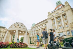 People in front of Gellért Bath – a century-old thermal bath in Budapest