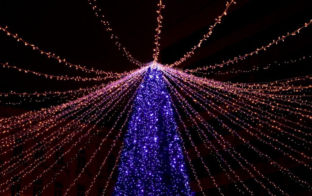 overhead string lights at christmas market